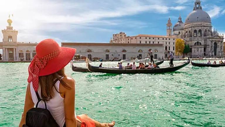 Solo Woman Traveller Relaxing and Starring Something While Boating.