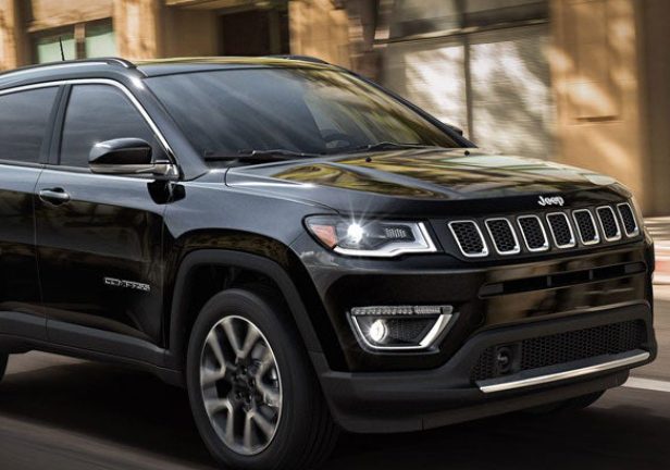 Black and Beautiful Jeep Compass Vehicle On Road.